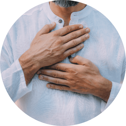 man with hands on chest